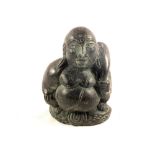 A small black shale Buddha