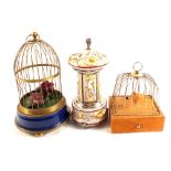 Two singing birds in cages (one on swing) plus a Capo di Monte musical dispenser