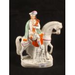 A Victorian Staffordshire equestrian bagpiper