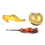 Avery horseshoe needle case and a Brass boot wooden handled button hook