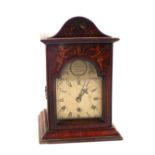 A Georgian mantel clock with fusee movement and silvered dial in Mahogany case painted with figure,