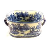 A reproduction blue and white pottery footbath