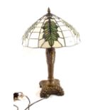 A table lamp with Tiffany style shade