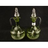 A pair of Mary Gregory green glass decanters