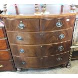 A Victorian mahogany bow front chest of two short over three long drawers on bun feet