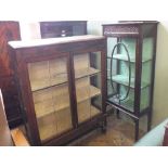 An oak china display cabinet and a mahogany display cabinet