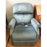 A nearly new blue upholstered electric reclining armchair