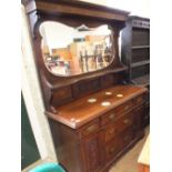 An Edwardian carved mahogany mirror back sideboard