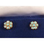 A pair of 9ct Gold Opal set stud earrings of flower form