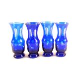 A set of four Bohemian blue glass overlaid vases