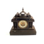 A Victorian black marble striking mantel clock