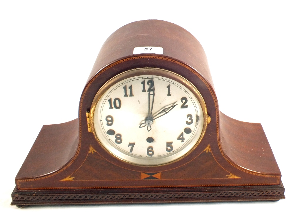 An Edwardian Mahogany striking mantel clock