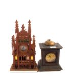 A Junghams alarm clock in carved Oak case plus a fretwork mantel clock