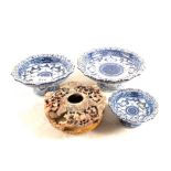 A Chinese soapstone pot and three blue and white stem bowls