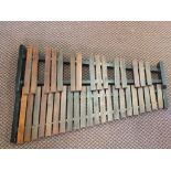 A wooden framed xylophone with Mahogany keys and carry case