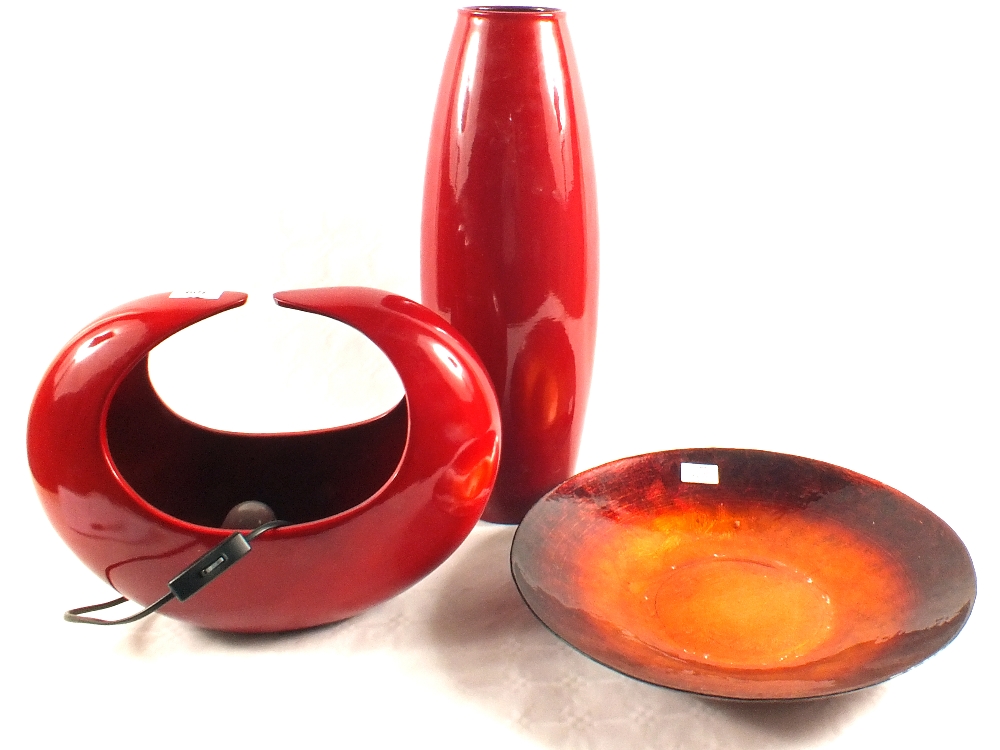 A 'Next' maroon pottery table lamp and vase plus an orange enamelled dish