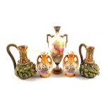 A pair of 19th Century pottery green leaf relief jugs,