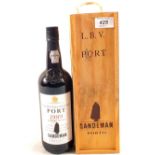 A cased bottle of Sandeman Port 1989,