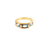 A 9ct Gold ring set with three oval blue stones and small Diamonds,