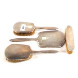 A Silver four piece engine turned brush and mirror set