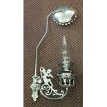 A chromium plated hanging oil lamp with Pan Piper design and ruby glass bowl