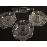 Three Robert Burns glass commemorative plates plus a ship in a bottle