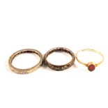 A 9ct Gold ring set with a small oval cut red stone,