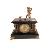 An American Sessions striking mantel clock with spelter blacksmith mount