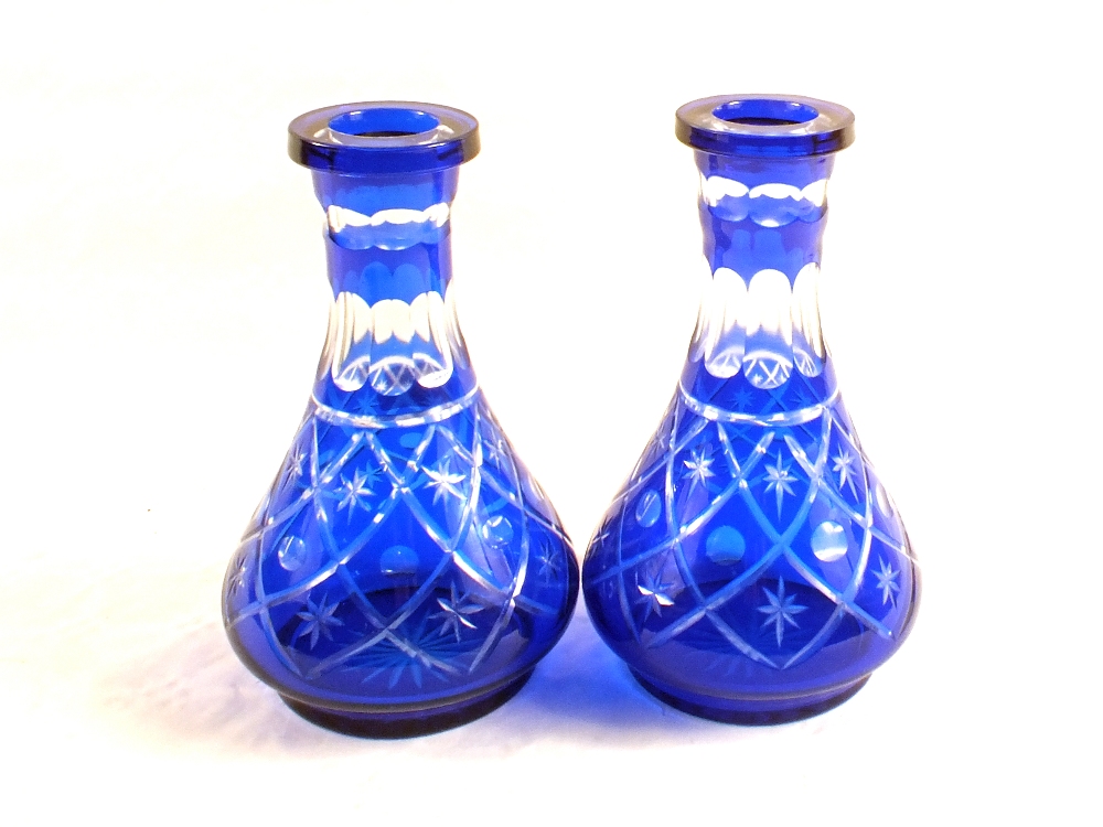 A pair of Bohemian blue glass overlaid carafes