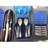 A cased bone handled carving set and part sets,