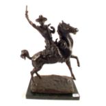 A Bronze of a mounted cowboy on marble base, signed Russell,