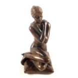 A Bronze of a seated unclad lady, signed base,