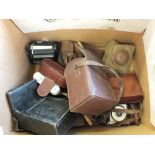 Two boxes containing cameras and Victorian drawer knobs etc