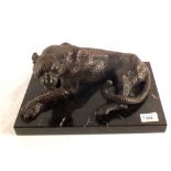 A Bronze of a seated leopard on marble base,