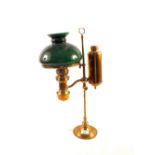 A Brass students oil lamp with green glass shade