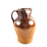 A large early 19th Century stoneware jug (rim chip)