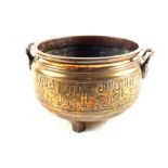 A Chinese bronze censer on three feet with archaic design, height 8",