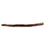 A heavy Tribal wooden carved stick with head top with snake climbing,