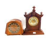 A carved mahogany and a walnut mantel clock