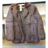 A lady's brown fur jacket