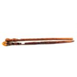 South African and one Tanzanian carved wooden walking sticks