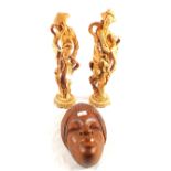 A pair of resin Oriental figures plus a carved African wooden mask