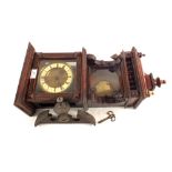 A Victorian carved mahogany striking wall clock