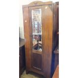 An oak single mirror door wardrobe