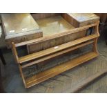 A light Ercol plate rack