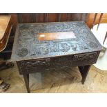 A Chinese carved hardwood altar table with elaborate dragon,