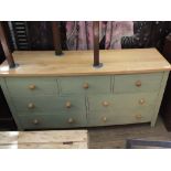 A modern painted pine seven drawer sideboard