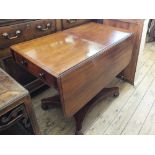 A 19th Century mahogany drop leaf table with single drawer on square tapered column and platform