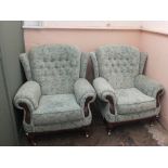 A mint green four piece suite comprising a sofa,