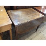 A Victorian inlaid mahogany Pembroke table with rounded flaps on square tapered legs and single